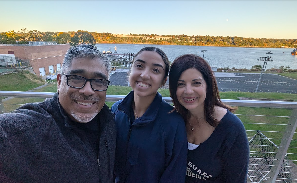 Carlos with is Daughter and Wife in Connecticu in Fall after her Volleyball Practice.